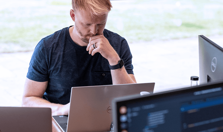 Developer Matt G working on his laptop